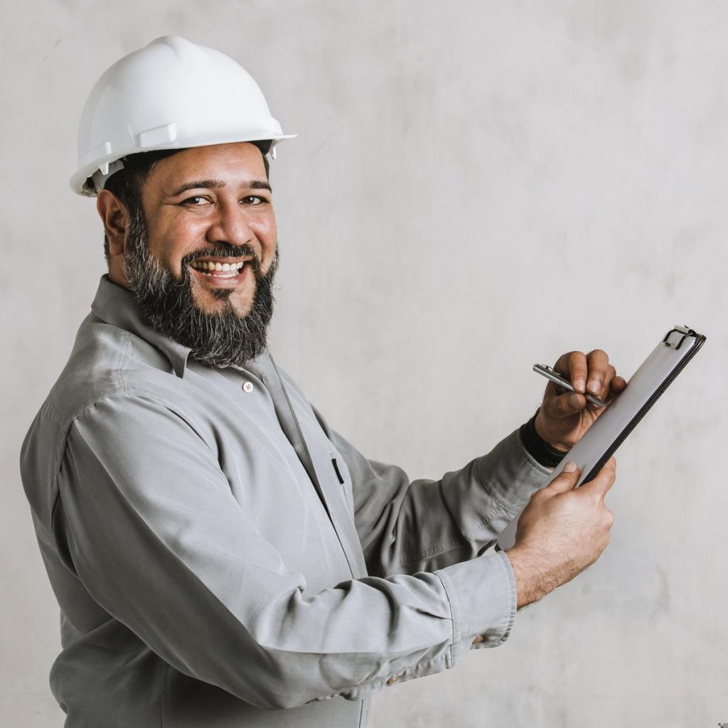 indian-engineer-writing-on-a-paper-clipboard-2025-02-10-08-54-22-utc